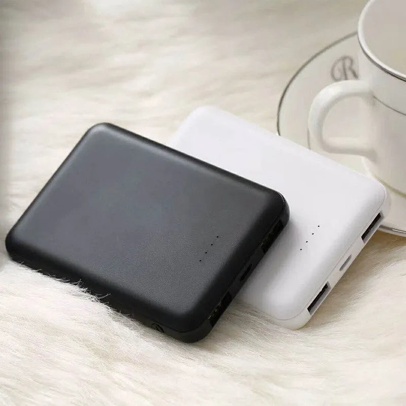 Portable mini 5000 mAh mobile power supply in black with multi USB port output