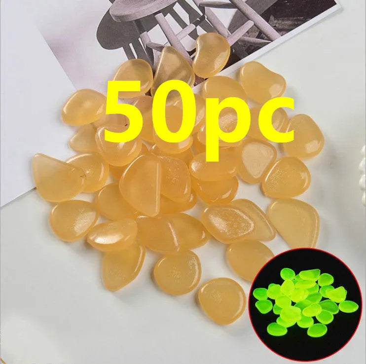 Luminous fluorescent aquarium and garden pebbles in mixed colours including dark purple, yellow, light blue, pink, orange