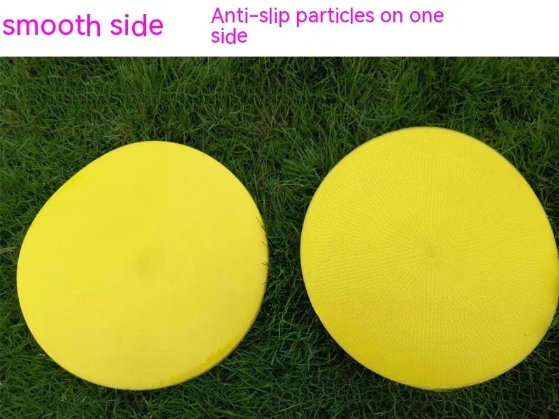 23cm diameter football training landmark pad in bright colours on grass field