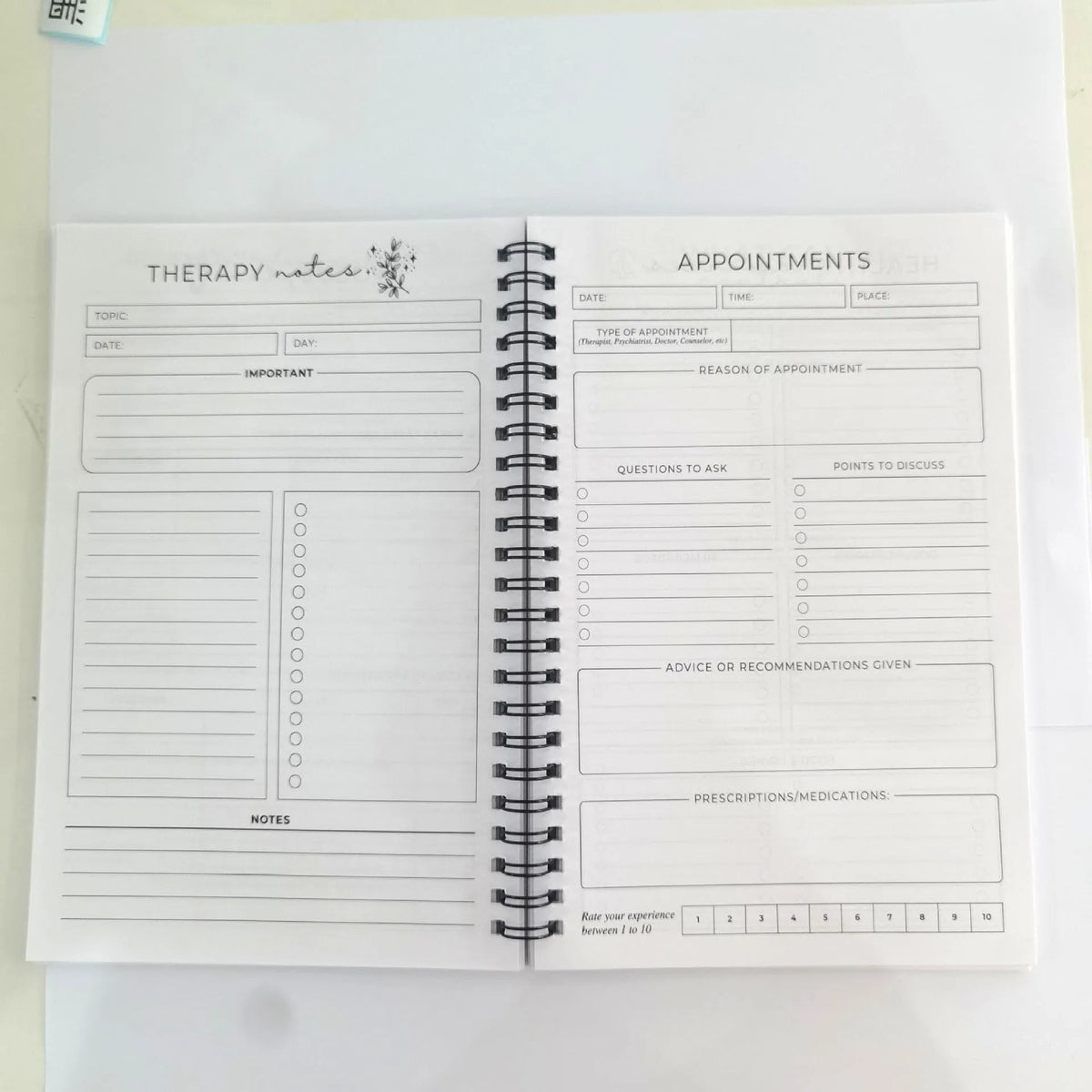 Pink brain mental health planning notepad with coil binding and 80g paper pages