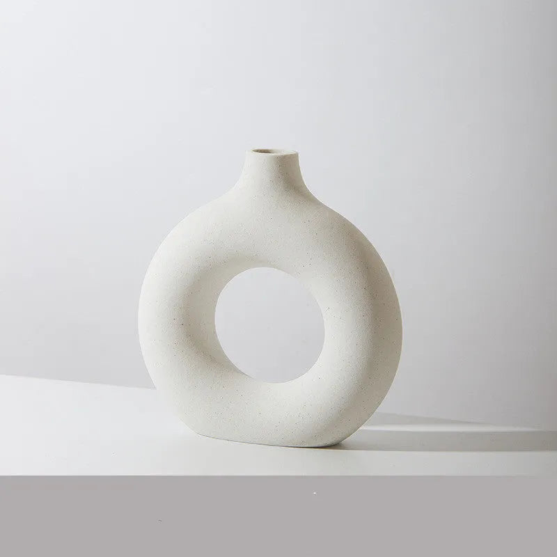 Unglazed porcelain biscuit vase with frosted particle surface in neutral colour
