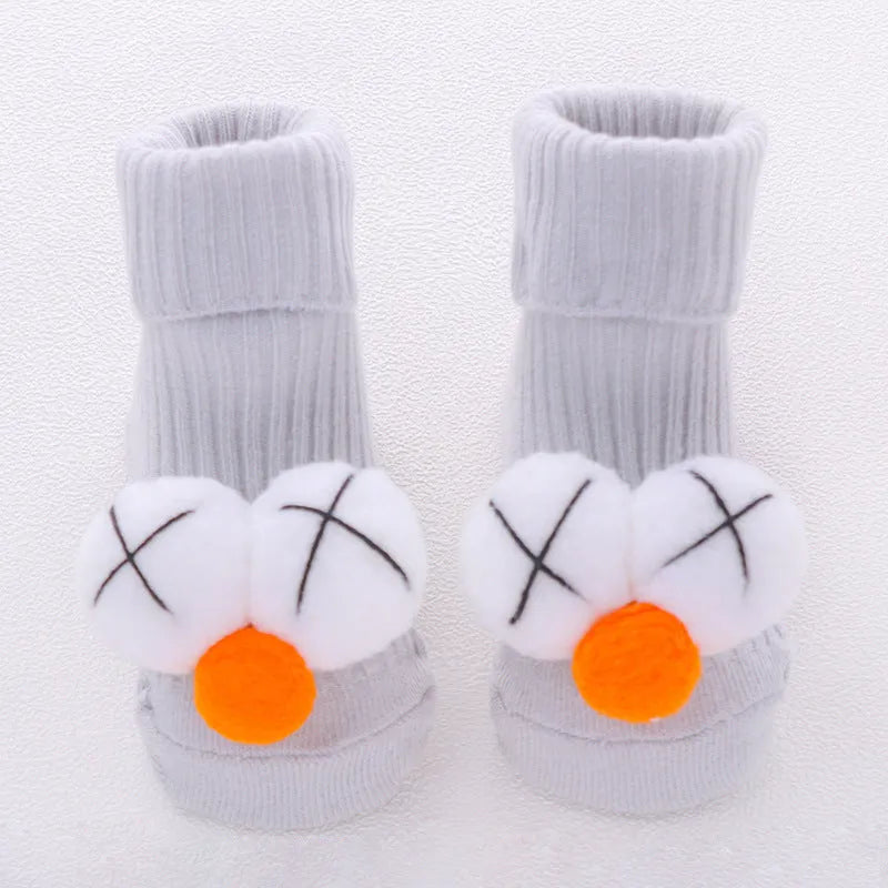 Cotton baby floor socks in multiple designs including panda, bow, and star patterns.