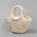 Hand-woven dumpling-shaped handbag with wooden beads in milky white colour