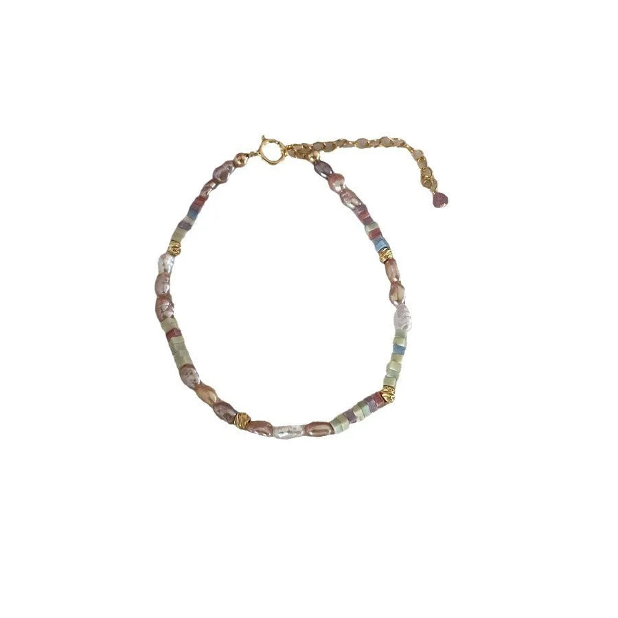 Women's natural pearl bracelet and necklace set with 14K gilded purple silver accents on irregular mini pearls