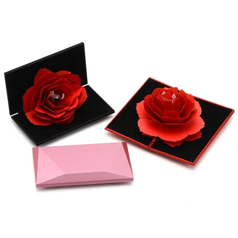 Red heart-shaped rotating ring box with 3D love motif and rose decoration for jewellery packaging
