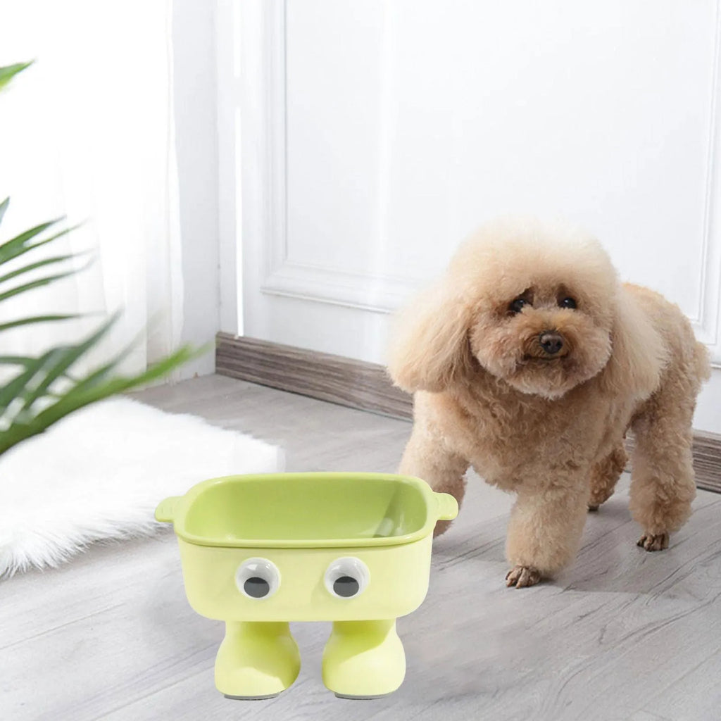 Green robot-shaped elevated cat bowl with tilted design and removable inner bowl on anti-slip base