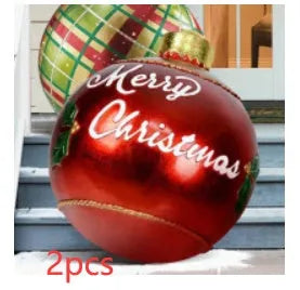 Large red and white striped inflatable Christmas ball ornament hanging on an outdoor tree
