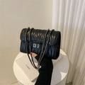 Retro textured diamond pattern women's small handbag in a choice of colours showing front view and internal phone pocket.