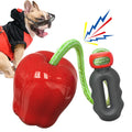 Green and red plastic dog toy shaped like a molar with a hollow centre for treat dispensing.