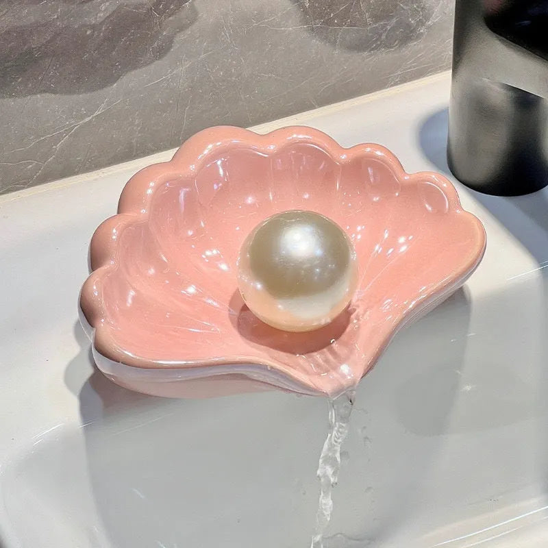 Shell-shaped plastic soap dish in pearl white or cherry blossom pink for bathroom storage
