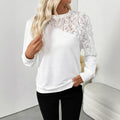 White women's long sleeve top with floral pattern, loose fit, and pullover style.
