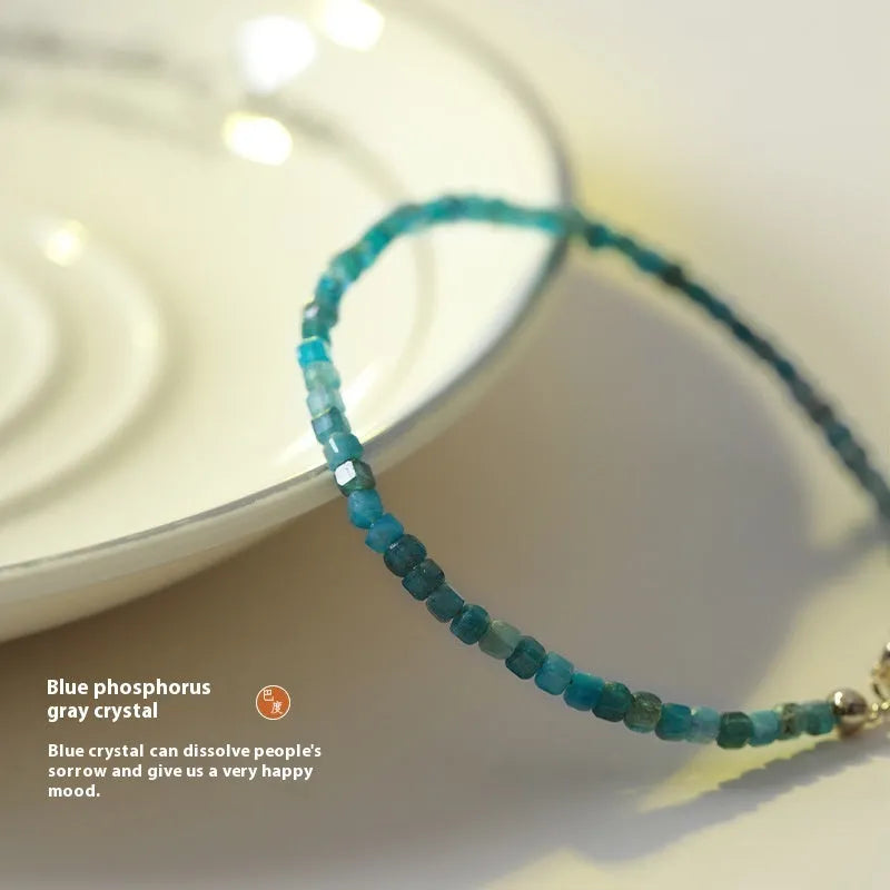 Women's natural blue apatite crystal bracelet with diamond-cut facets on adjustable band