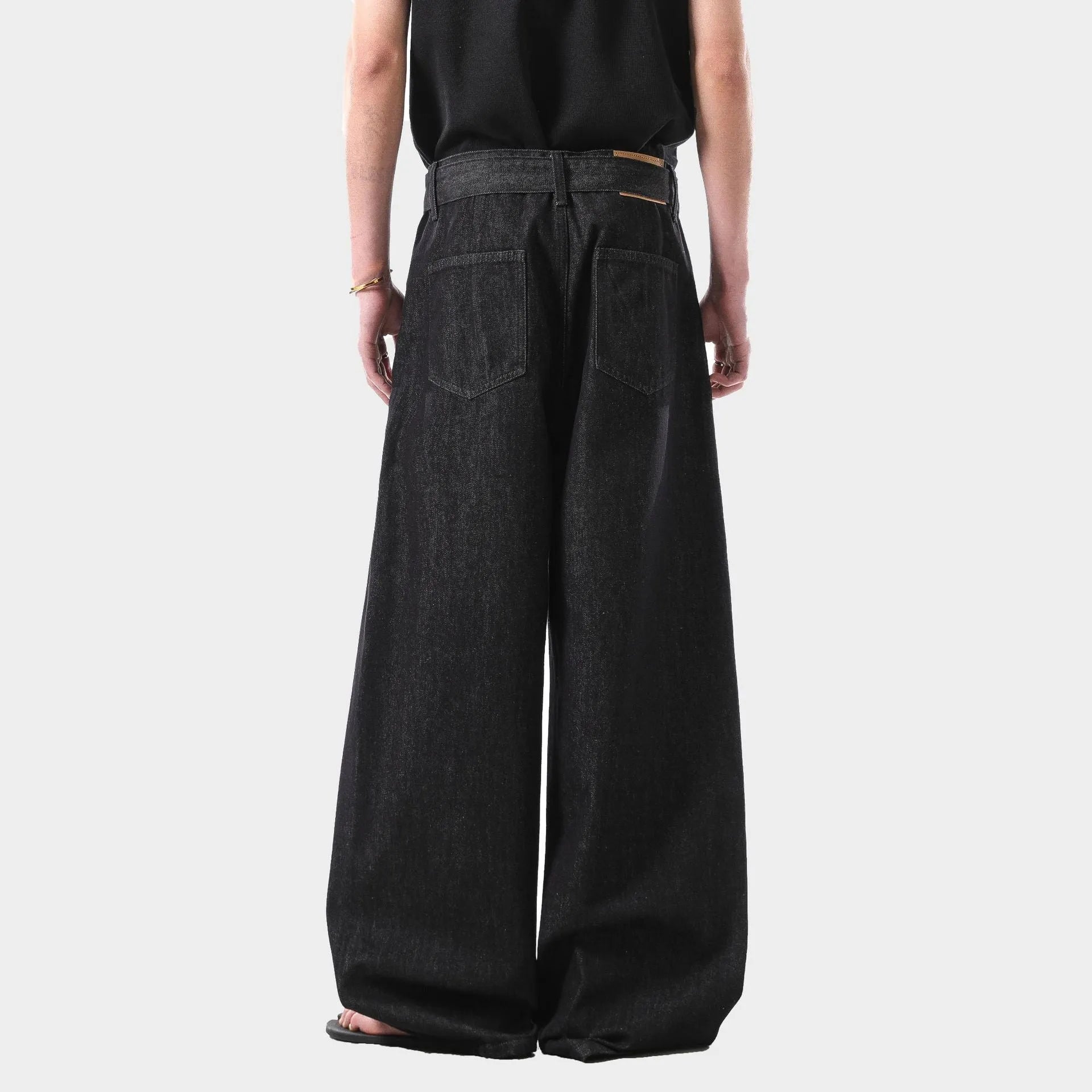 Black high waist straight leg jeans with a zip fly, shown flat.