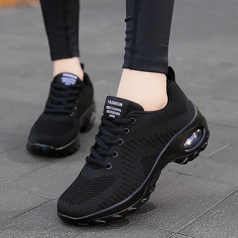 Red and black women's low-top mesh sneakers with front lace-up and a round toe.