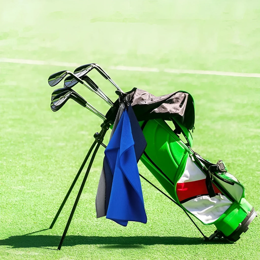 Waffle weave golf ball cleaning towel in blue, shown next to a golf ball.