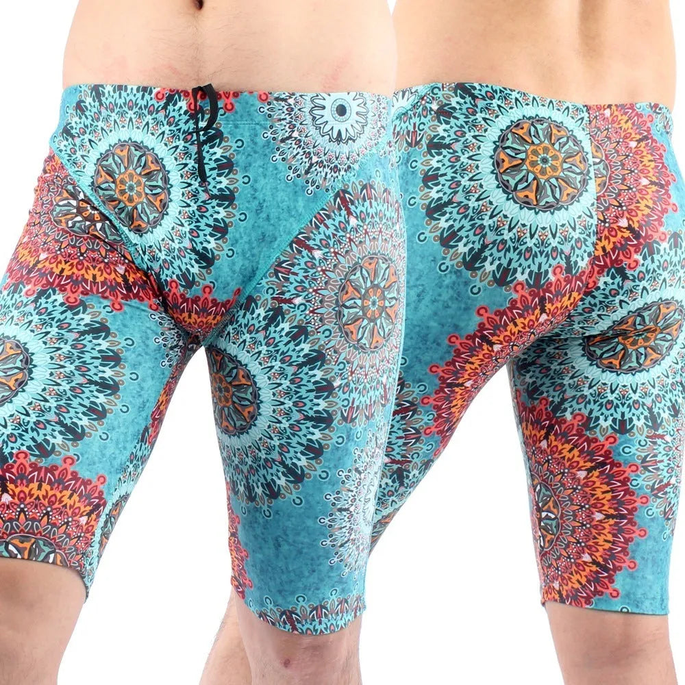 Green and navy blue men's loose-fit swimming trunks with a five-point design and polyester lining.