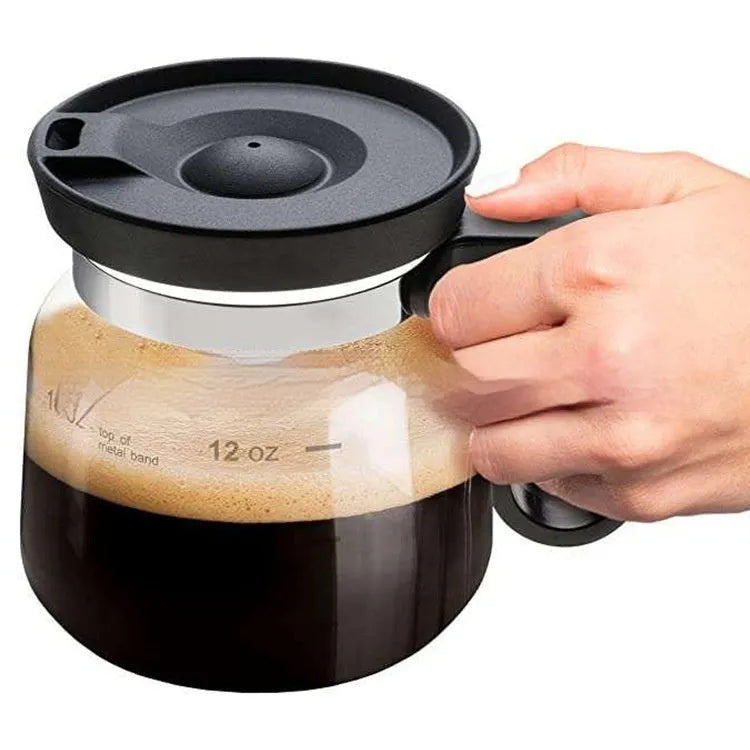 Transparent borosilicate glass coffee maker with silicone cover on a kitchen countertop, 355-473ml capacity
