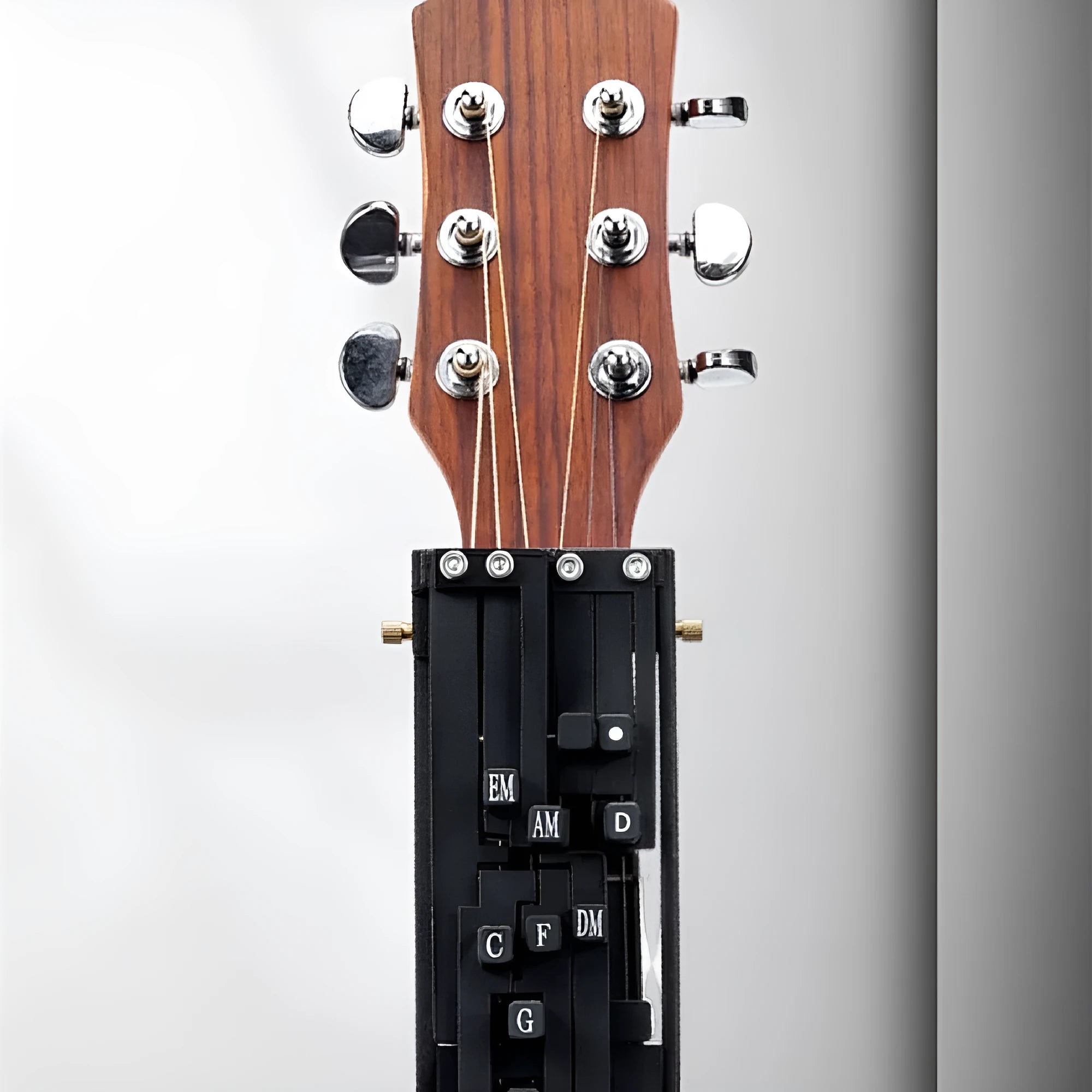 Black automatic chord changing device for folk guitar practice with singers