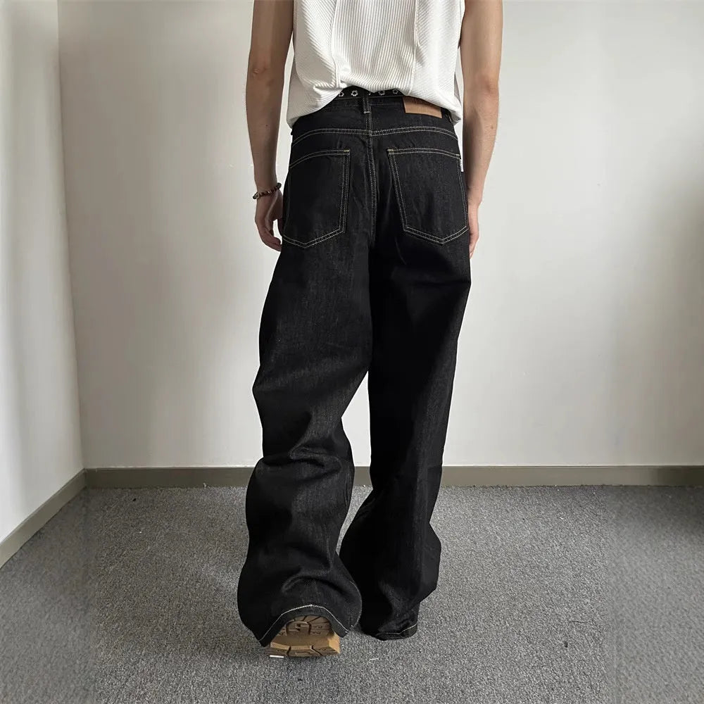 Black straight-leg wide jeans with zip fly and mid-waist design