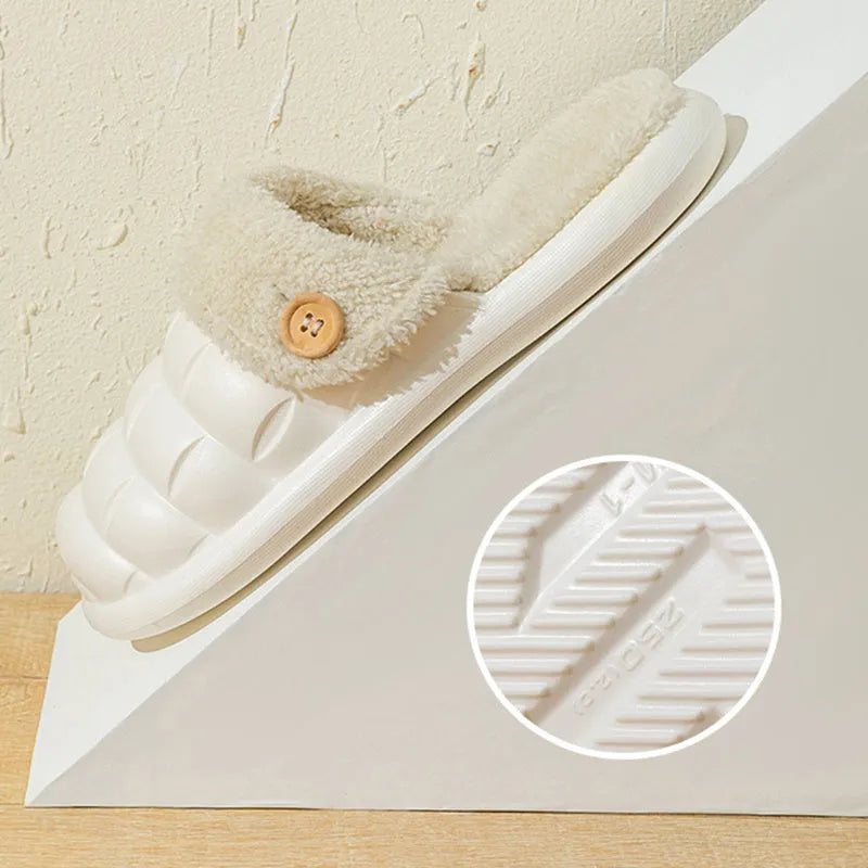 Plaid detachable slippers for women with plush lining and EVA sole in pink, shown on a wooden floor.