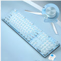Sky blue retro punk mechanical keyboard with white backlight and green switches alongside wired mouse on a wooden desk