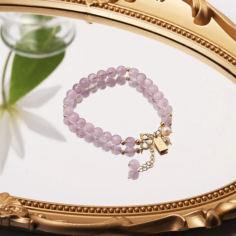 Natural crystal women's bracelet with lavender amethyst stones and animal/Zodiac motif in dark and light colour variations