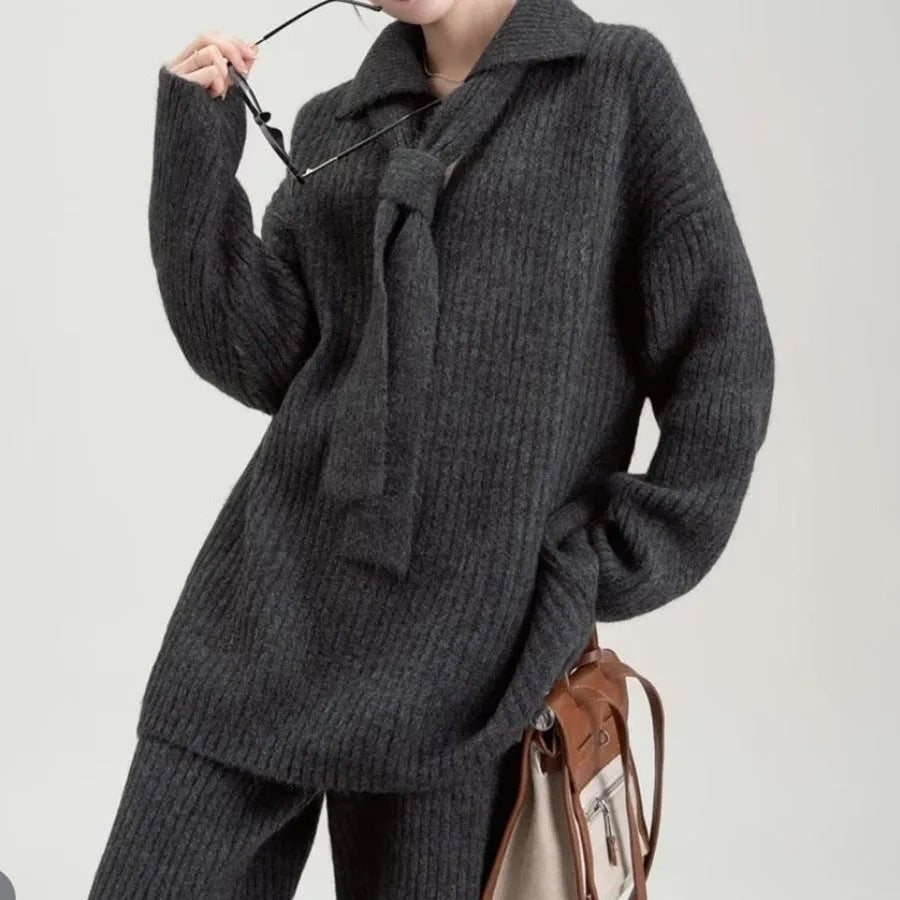 Acrylic fibre sweater suit two-piece set in beige, showing knitted top and casual trousers.
