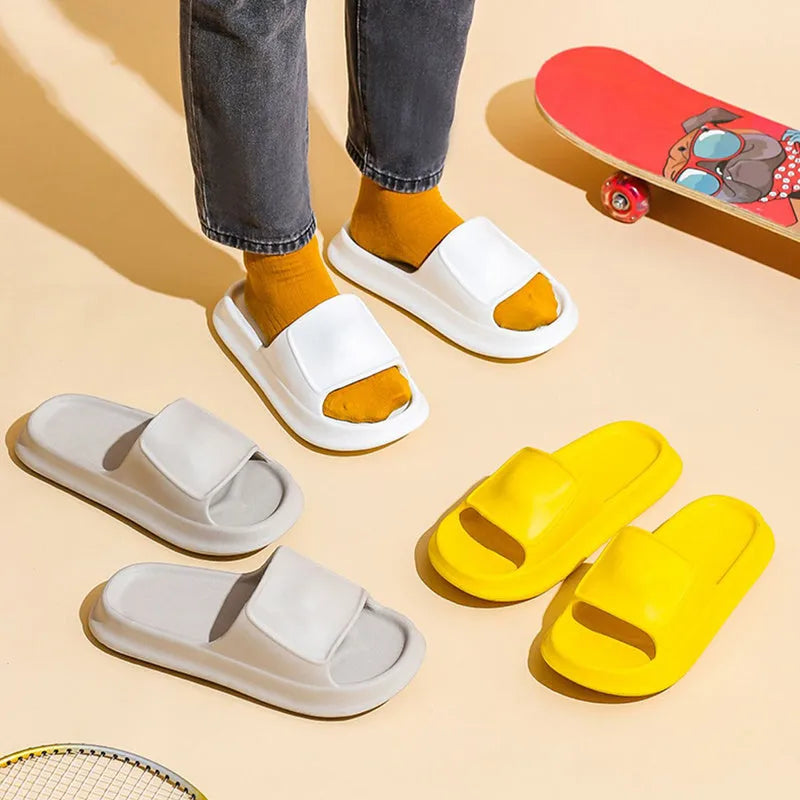 Pair of thick-soled EVA flip-flop slippers in a choice of seven colours, shown on a wet bathroom floor.