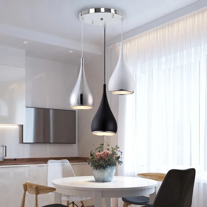 Minimalist iron chandelier pendant light in black finish with three bulb heads.