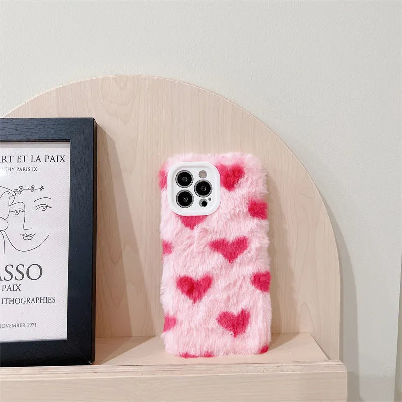 Pink silicone iPhone case with Love Plush cartoon design, shown as a back cover.