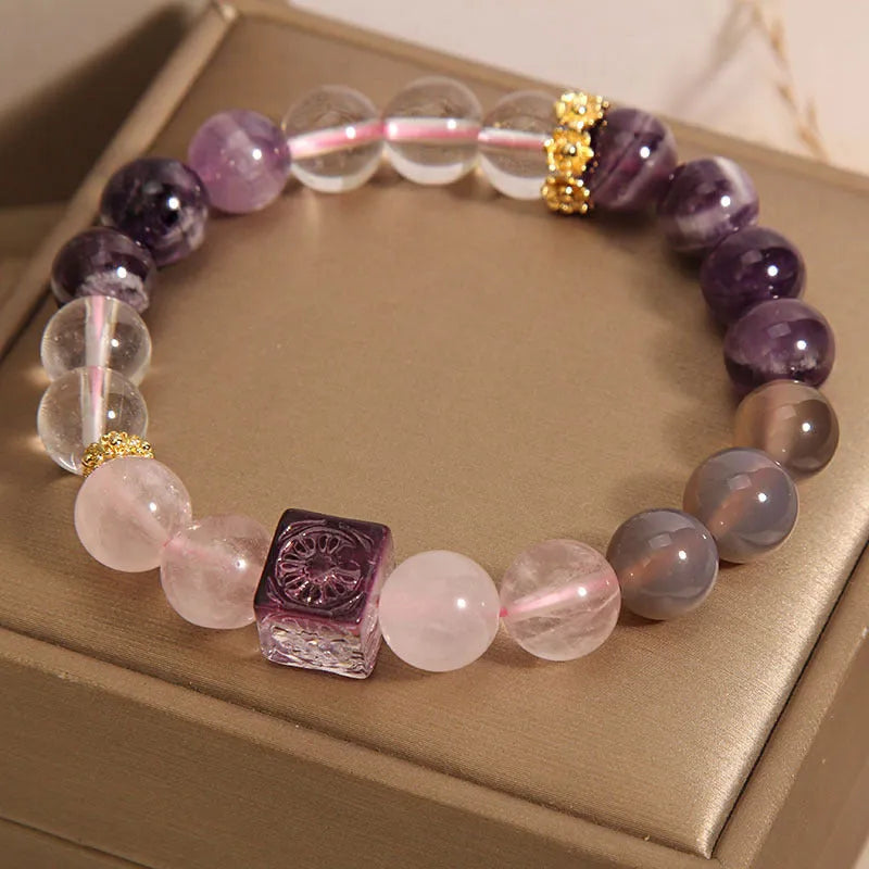 Women's purple amethyst crystal bracelet with rhinestone details measuring 10mm