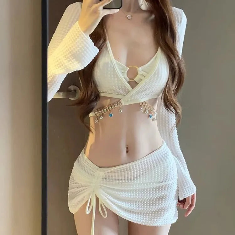 Women's long sleeve black and white bikini swimsuit for swimming.