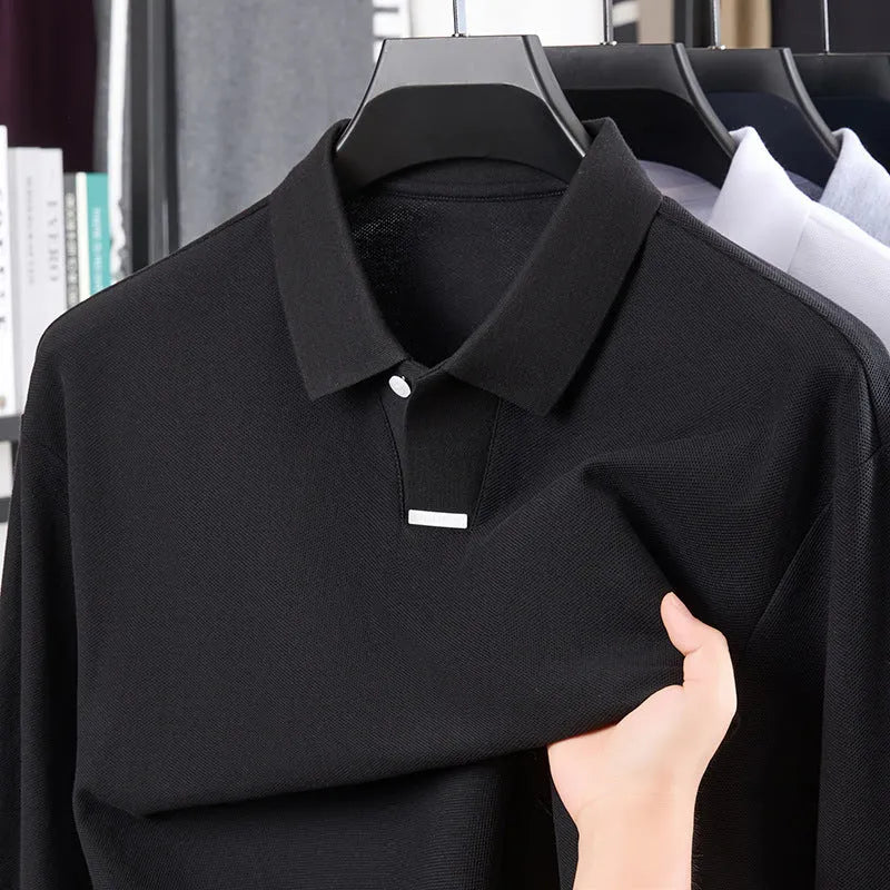 Men's grey loose fit cotton polo shirt with long sleeves and a lapel collar on a hanger.