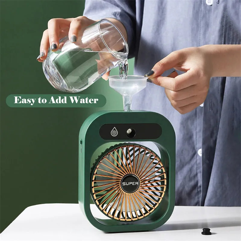 Green USB rechargeable misting fan with 3 speed settings and adjustable head on a desk