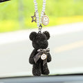 Crystal rhinestone Violent Bear car rearview mirror pendant in black, white, and mixed pastel colours.