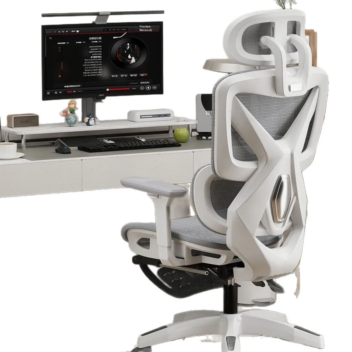 Ergonomic gaming chair with black frame, mesh seat, 4D adjustable armrests, and footrest on a neutral background