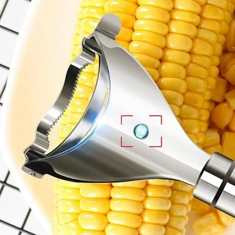 Stainless steel corn planer kitchen tool on a wooden surface