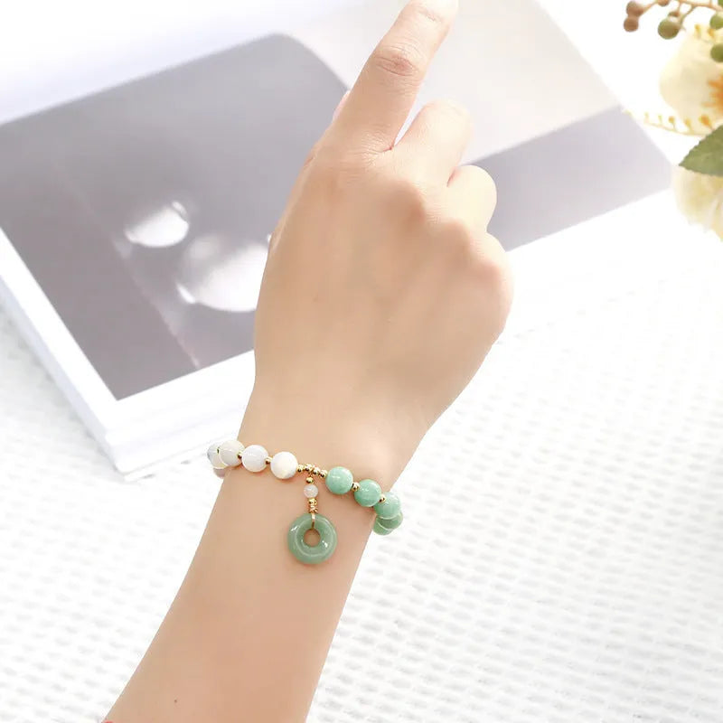 Women's blue Burma jade bracelet with geometric design and horseshoe screw safety buckle