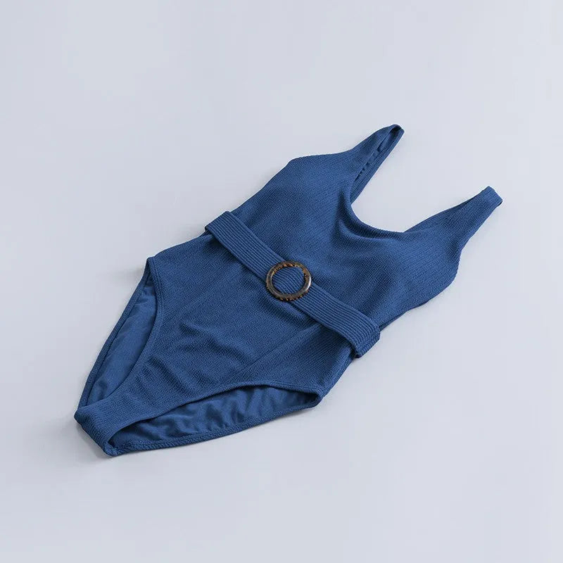 Navy blue solid colour women's one-piece slimming swimsuit with triangle shape and removable chest pads.