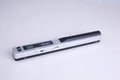 A handheld plastic scanner shown in five colour options: black, blue, green, red, and silver.
