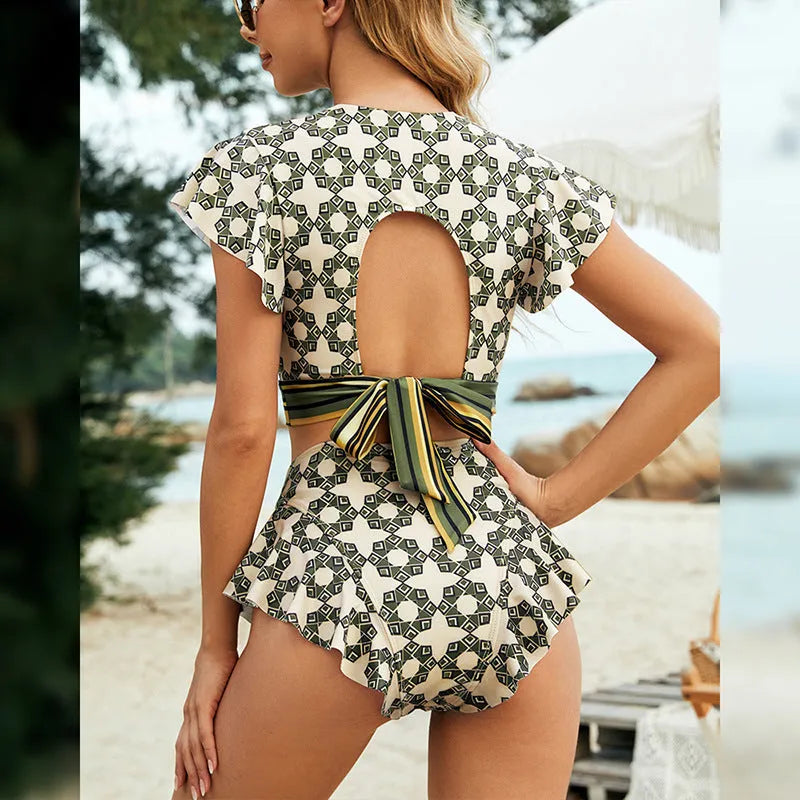 Green flounced backless bikini swimsuit with lace-up V-neck top and split shorts.