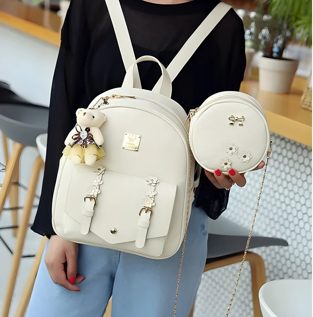 Floral design women's 3-piece PU leather bag set showing backpack, shoulder bag, and card purse.