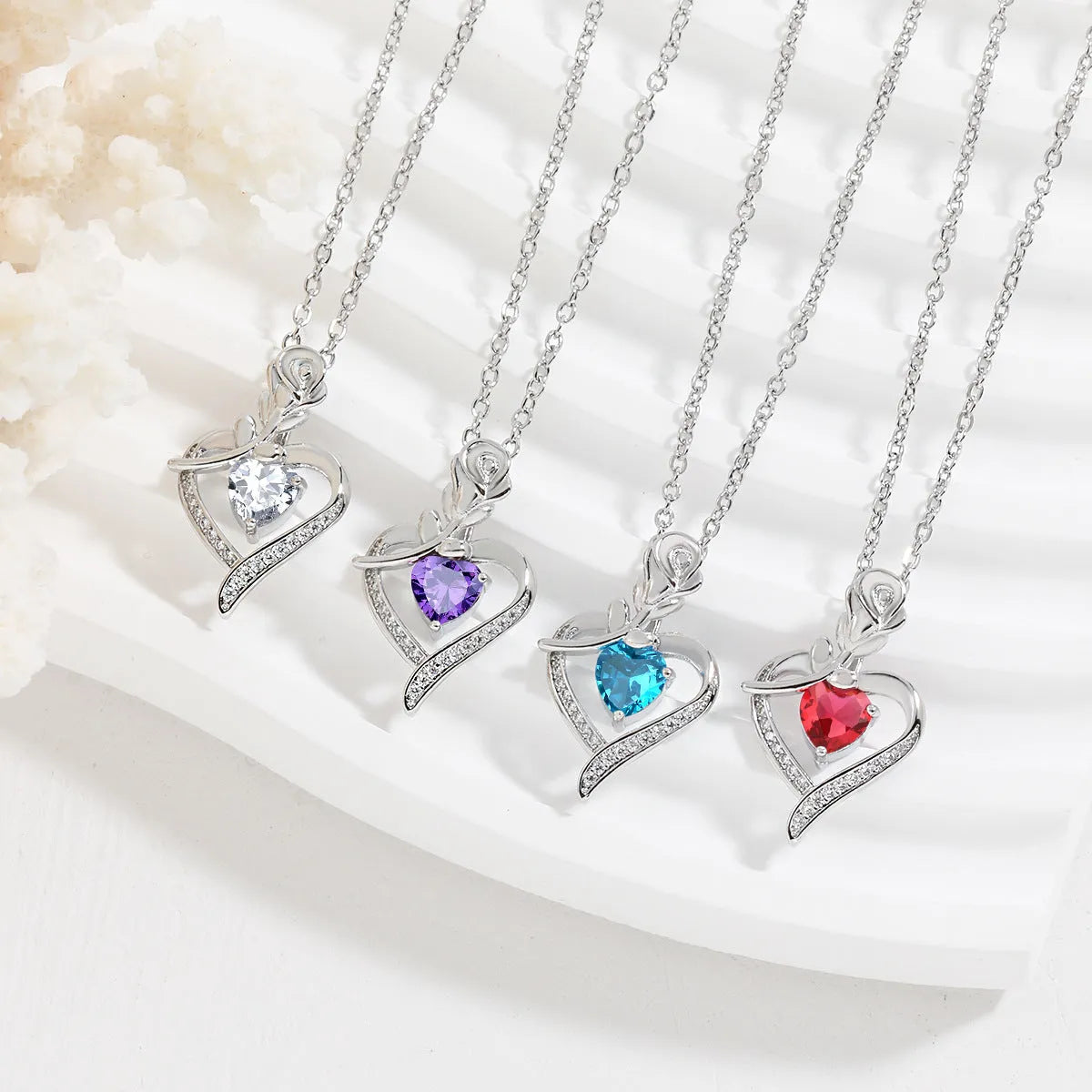 Rose heart-shaped necklace with rhinestones in copper electroplated finish, available in blue, purple, red, or white
