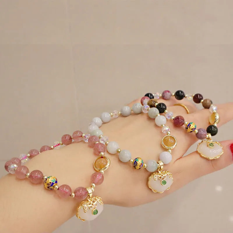 Women's geometric bracelet in choice of gray jade or strawberry quartz with ethnic metal decorations