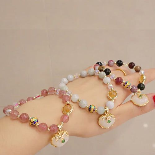 Women's geometric bracelet in choice of gray jade or strawberry quartz with ethnic metal decorations