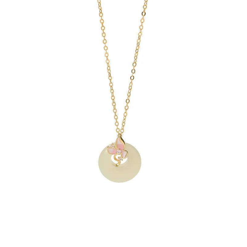 Sterling silver orchid necklace on a model, showing the floral pendant and peace buckle clasp.