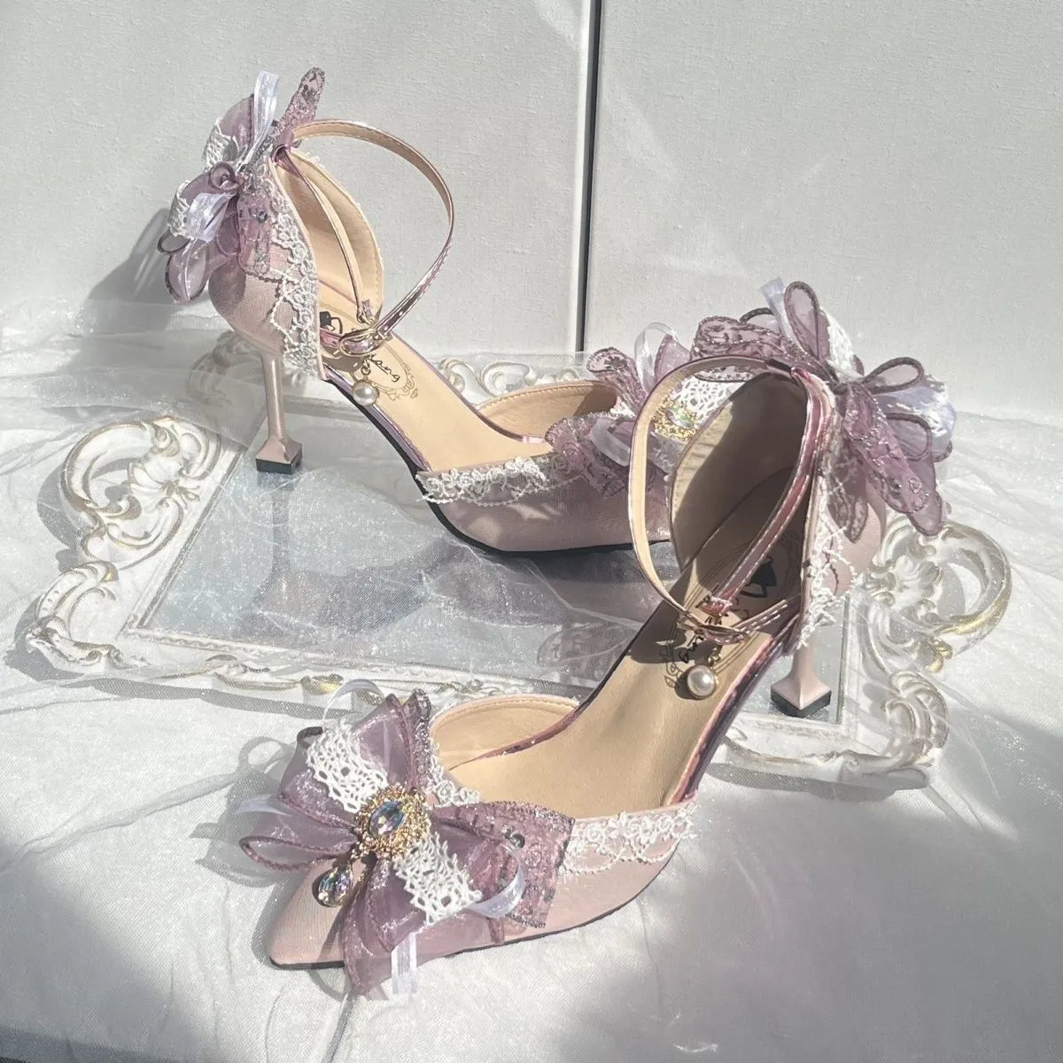 Purple satin Lolita shoes with a stiletto heel and square toe on a white background.