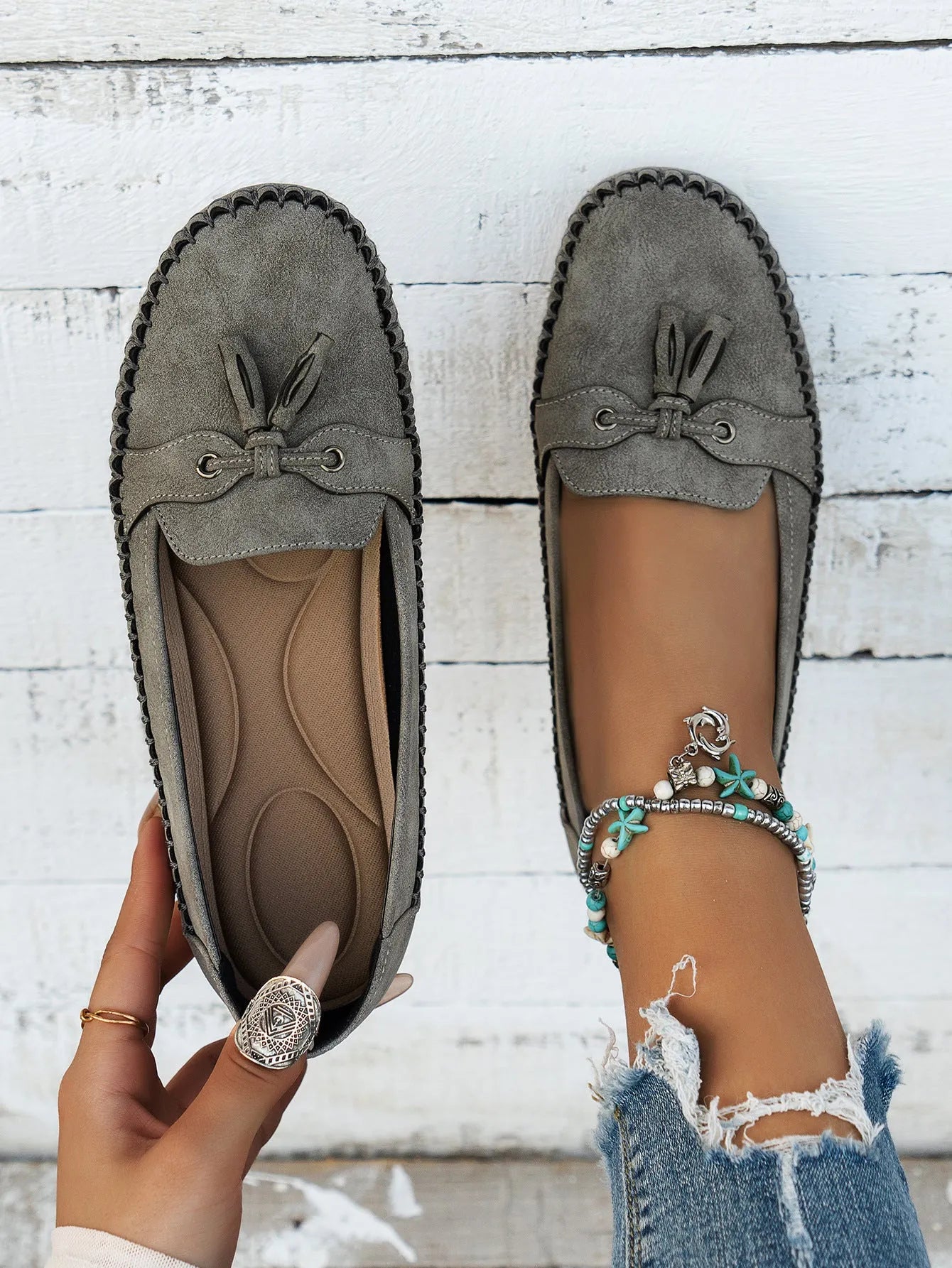 Women's casual flat shoes with bow detail in suede, shown in a solid colour.
