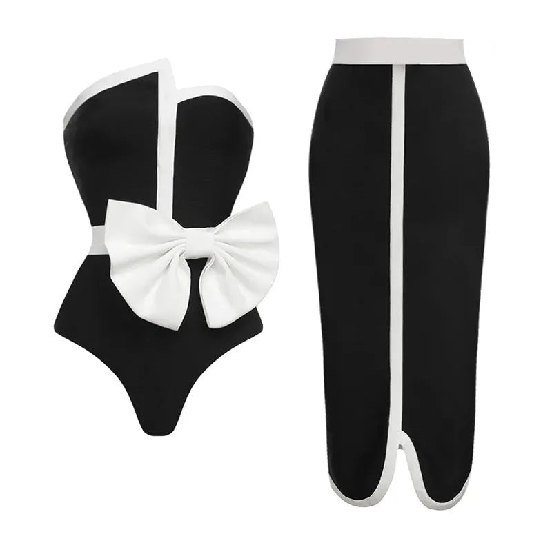 Women's black and white colour-block one-piece swimsuit with irregular tube top and bow detail