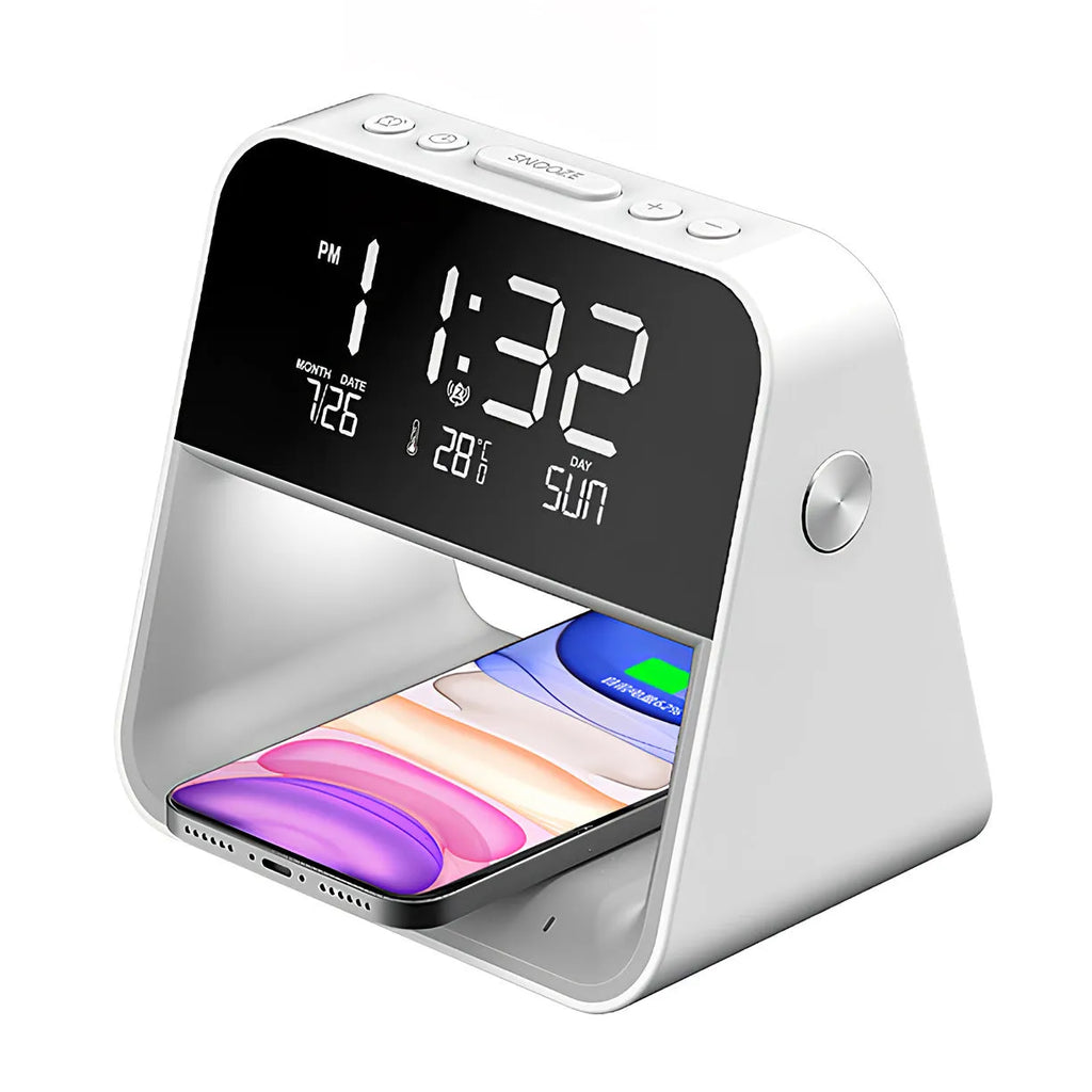 White multifunctional bedside lamp with wireless mobile phone charger and alarm clock on a nightstand